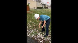 Woman self-appoints herself as weather reporter during intense hailstorm