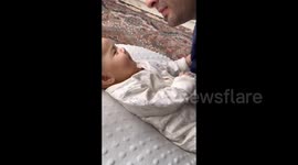 Baby Refusing Uncle's Kisses in Xinjiang, China