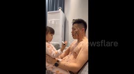 Dad adorned with black marker scribbles in Changchun, China