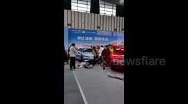 Multiple injuries as electric car malfunction causes collision at auto show