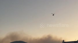 Helicopters battle to contain wildfire in Mexico