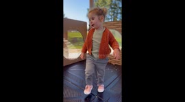 Startled girl encounters ant anatomy poster at jungle gym