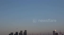 Dumbell like UFO is seen over the London Docklands during the March Full Moon