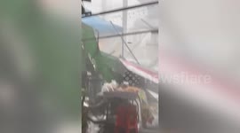 Storm batters market stalls in Thailand