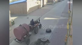 Tractor moves along street unattended after driver forgets to turn off engine and leaves