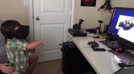 Three-year-old tries out virtual reality headset for the first time