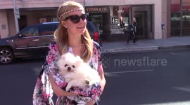 Paris Hilton takes time to pose for selfies with fans while out shopping in Beverly Hills, Ca