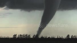 Stunning footage of moment tornado makes contact with ground in Manitoba, Canada