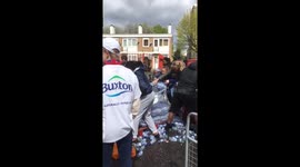 People in Deptford steal water from workers at London Marathon