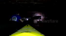 Young explorers kayak through a creepy abandoned iron mine