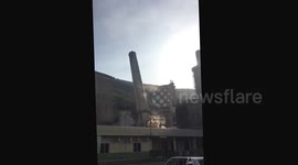 Two large smoke chimneys demolished with explosives in Jamaica