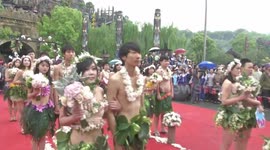 'Naked' couples get married in the rain