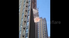 Wall falls off high-rise building in China
