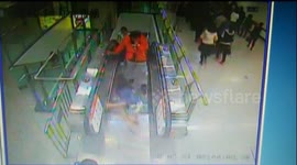 Woman's high heels get stuck in escalator