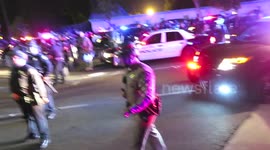 Police respond to being hit with a bottle by closing down on the protesters at the Donald Trump Rally at the Costa Mesa Fairgrounds in Costa Mesa, CA