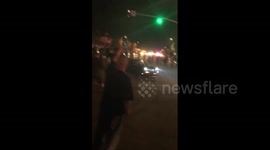 Driver does 'donuts' as a crossroads during Trump rally