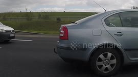 Skoda driver talking on the phone M50 Dublin Ireland
