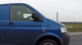 VW van man talking while driving M50 Dublin Ireland