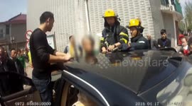 Firefighters rescue boy with head stuck in sun roof