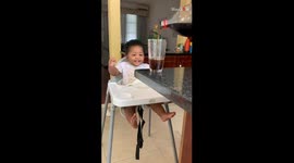 Bubble trouble: Baby's adorable antics for a taste of Cola bliss