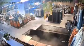 Shopper engulfed as floor collapses at Chinese supermarket