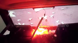 Shocking moment egg-sized hailstones piercing through car windscreen in China
