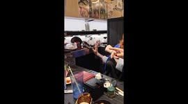 Customers panicked as plates pile up on sushi bar conveyor belt