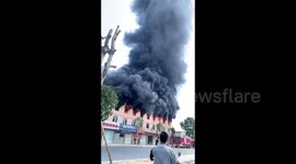 Worker jumps out of window to escape burning factory in southern China