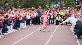 Teenage girl with cerebral palsy smiles through sports day race with mother's support in China