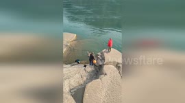 Little boy saved from drowning by locals in China