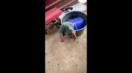 Toddler takes a tumble in double bucket mishap