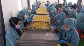 Indonesian Workers Make Cookies For Eid Al Fitr Celebration
