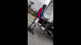Rollerblader hilariously hitches ride behind delivery truck