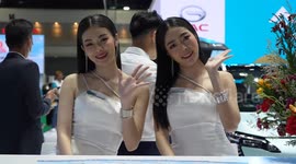 Models pose with cars at Bangkok International Motor Show 2024