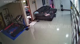 Chilling moment poltergeist appears to hurl baby from sofa