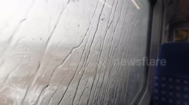 Waves whipped up by Storm Nelson batter trains in town on Devon coast