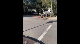 Worker Chucks a Brick From Manhole