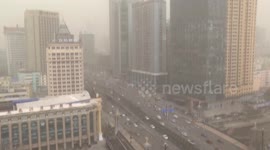 Drifting sand, dust sweep northeast China