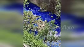 River shocks city residents after suddenly turning dark blue colour