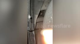 Scared stray kitten hiding under car engine rescued