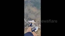 Innovative Angler Uses Shoelace as Fish Hook in Luzhou, China