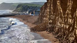 A large cliff rockfall has blocked the beach at the seaside resort of West Bay in Dorset, UK after heavy rain and rough seas from Storm Nelson.