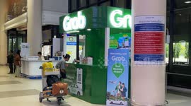 Ride-hailing app Grab takes on airport taxi cartel with its own booth