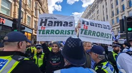 Israeli counter-demonsration is booed by passing pro-Palestine marchers in London
