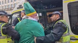 Pro-Palestine protester dressed as a bishop is arrested after shouting at pro-Israel counter-demo in London