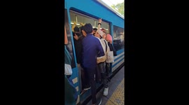 Room for one more? Packed train makes door closing a struggle