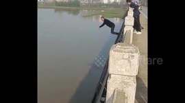 Retired soldier jumps from bridge to rescue woman falling into river in northern China