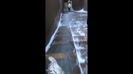 Ice Slide Symphony: Chinese Man Creates Melodic Descent Down Icy Stairs