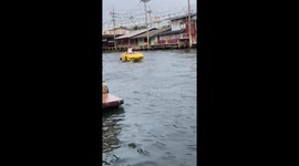 Boat shaped like a supercar floats through canal in Thailand