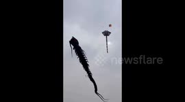 Senior citizen spotted flying giant kite shaped like centipede in Tangshan, China